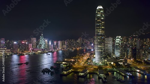 Wallpaper Mural Captured at night, the mesmerizing skyline of Hong Kong shines with colorful city lights. The bustling waterfront features boats and reflects the energy of this iconic metropolis. Torontodigital.ca