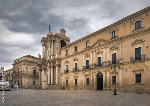 Exploring the Grandeur of Cathedral of Syracuse in Sicily Under Dramatic Skies, Italy