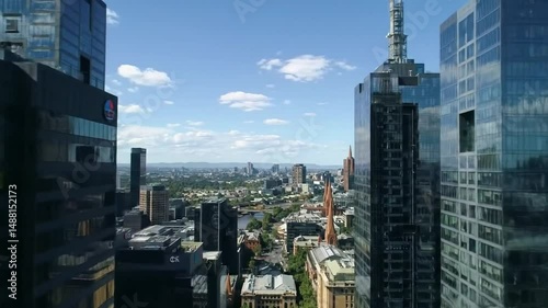 High-angle view of modern skyscrapers with city skyline and a beautiful blue sky on a sunny day