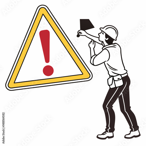 Worker inspecting large warning sign with exclamation mark