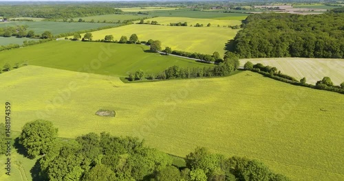 different fields and forest in germany landscape arieal with a blue sky and little clouds