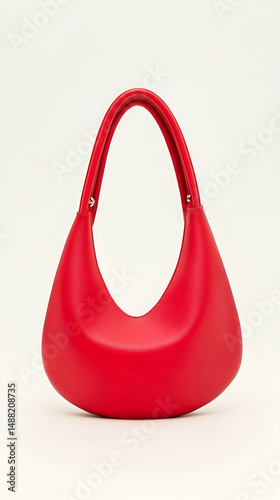 Red crescent handbag on white background; studio shot; fashion accessory; e-commerce product photo