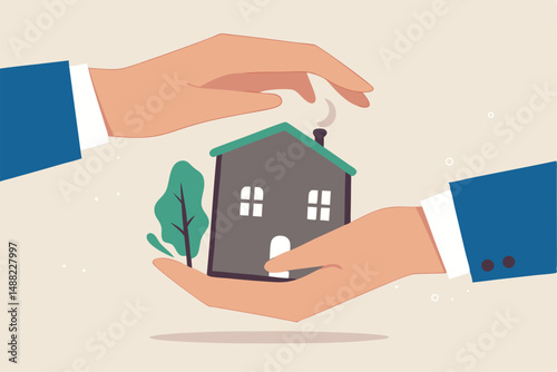 House insurance, real estate or property protection, home security concept, house in businessman palm with other hand cover to protect as insurance coverage.