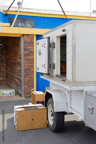 White refrigerated trailer used to transport fresh produce to the collection point photo