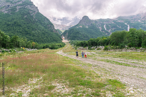 Family vacation in the mountains. Hiking in the mountains. A group of people is traveling high in the mountains. Vacation in the mountains.
