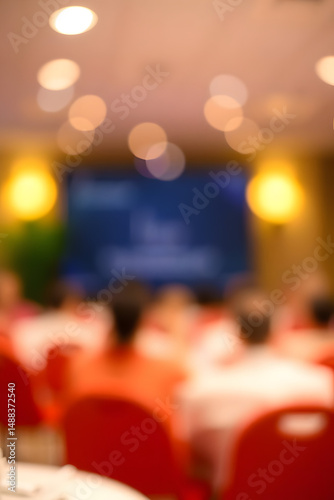Blurred audience during a presentation with bokeh effect for presentations and designs with copy space
