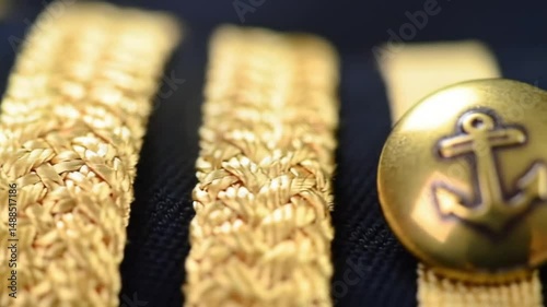 Extreme Close-Up of Naval Uniform Gold Braids and Anchor Buttons