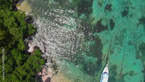 Cinematic drone view of Padangbai, Bali, Indonesia – a scenic port village and key ferry connection to Lombok and the nearby Lesser Sunda Islands.
