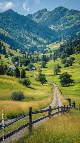 Scenic Mountain Valley With Winding Road and Lush Greenery in Summer
