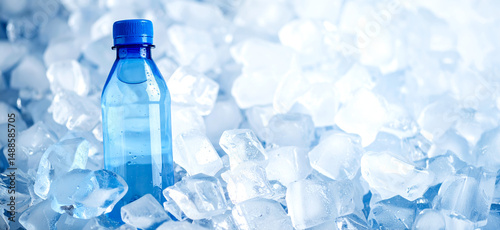 Plastic water bottle cooling on a bed of ice cubes