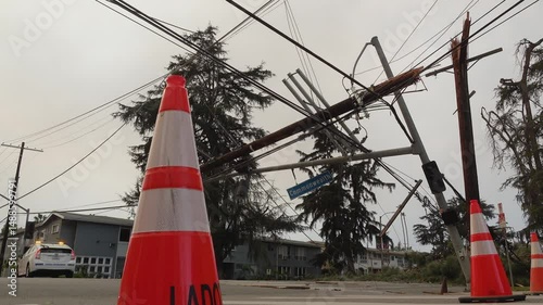 Power lines down with Orange and white cone