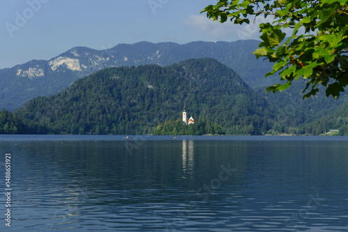 Wallpaper Mural very small island on natural bled lake in summer with church in middle and beautiful green trees around with blue waters and clear blue sky Torontodigital.ca
