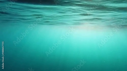 Underwater scene with sun rays, teal and aqua hues, representing aquatic depth and serenity
