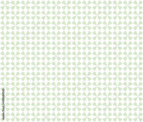 Delicate seamless pattern with clover leaves. Subtle background with sylized green flowers for textiles, wallpaper, and packaging