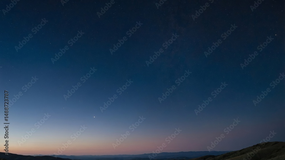Fototapeta premium Beautiful Twilight Skyline Reveals Stars Above Distant Mountains During Clear Evening in a Serene Rural Area