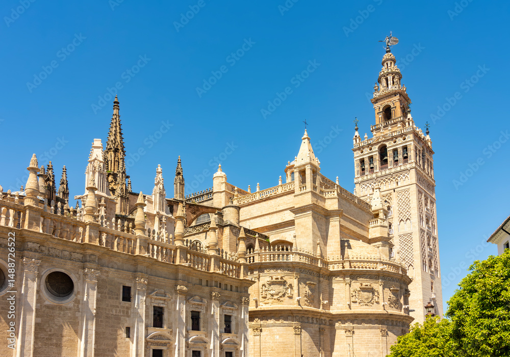 Fototapeta premium Triumph square with Giralda tower of Seville Cathedral, Spain