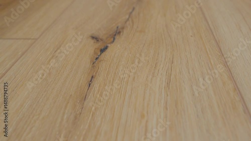 Wooden surface showcases natural grain patterns and textures in warm tones, perfect for interior design