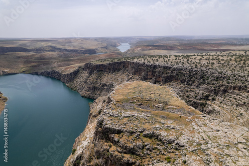 Aerial View of Ancient Settlement Remains along the Euphrates River with Surrounding Canyons – Hidden Archaeological Site in Southeastern Turkey