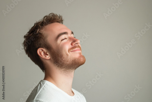 A close up of a man's face with her eyes closed