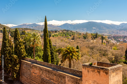 Alcazaba fortress of Alhambra with Sierra Nevada mountains at background, Granada, Spain