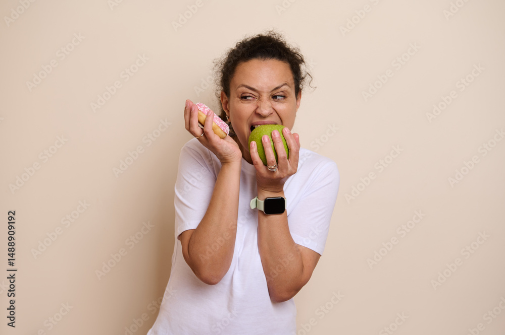 Health-Conscious Choice Concept Depicting a Woman Ambiguously Choosing Between a Green Apple and a Donut in a Humorous and Expressive Way Health-Conscious Choice Concept Depicting a Woman Ambiguously Choosing Between a Green Apple and a Donut in a Humorous and Expressive Way