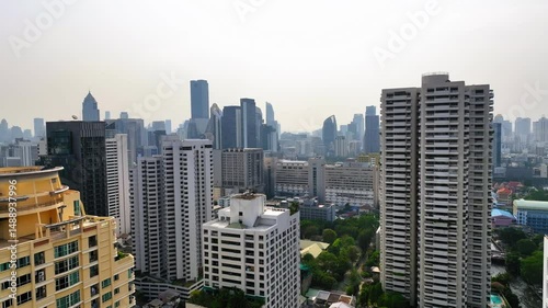 Aerial Shot Of Tall Modern Buildings In City, Drone Flying Forward Over Residential Landscape - Bangkok, Thailand
