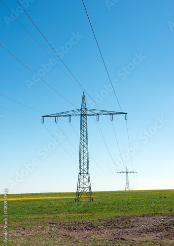 electricity pilons and green fields in germany
