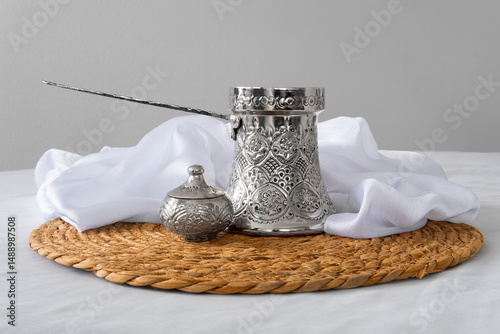 Traditional Coffee Set with Ornate Silver Pot and Cups

 photo