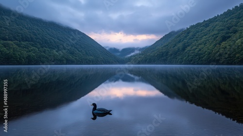 Serene Misty Lake at Dawn with Mountain Reflections