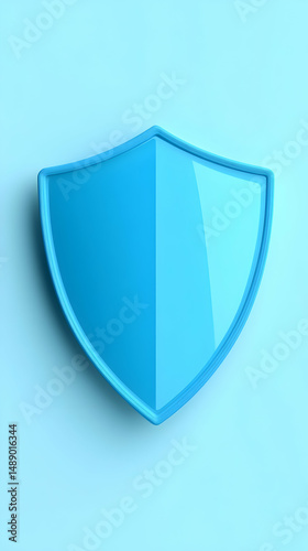 Free Download A light blue, glossy, shield-shaped object rests on a pale blue background, casting a subtle shadow - GFXLoad