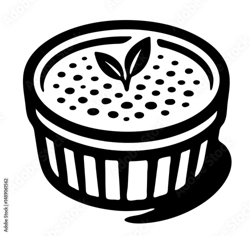black and white drawing of a creme brulee with a leaf on top.