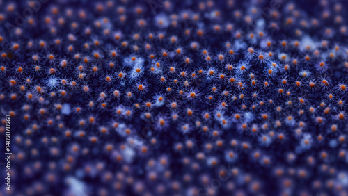 Close-up of a textured surface with small, clustered, orange-red and light-blue elements on a dark-purple background