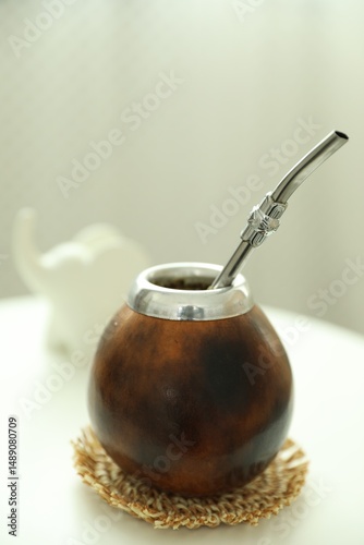 Traditional yerba mate tea on white table indoors, closeup