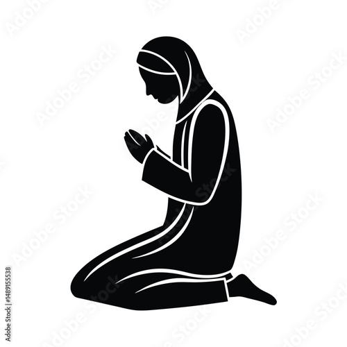 Woman in hijab kneeling in prayer silhouette