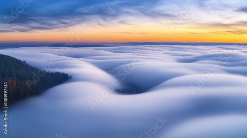 A bird's-eye view of a thick layer of clouds covering the ground below, creating a soft, blanket-like effect.