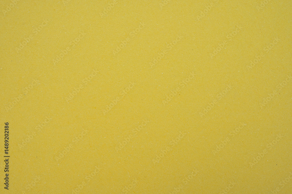 Fototapeta premium Full frame shot of yellow paper sheet texture and background.