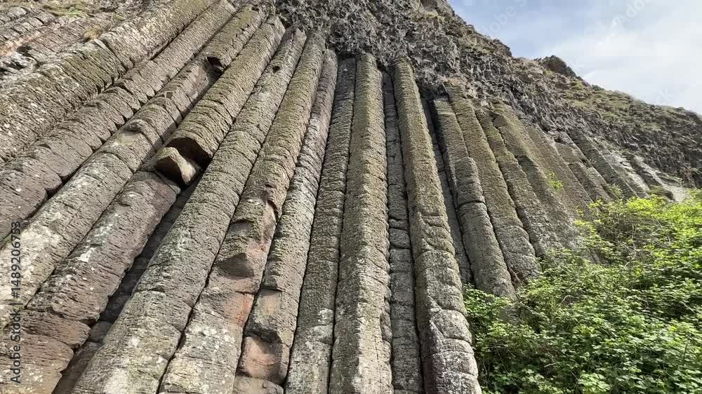 The Giant's Causeway, a UNESCO World Heritage Site on Northern Ireland's Antrim Coast, features 40,000 interlocking basalt columns formed by volcanic activity. Its hexagonal stones and coastal beauty 