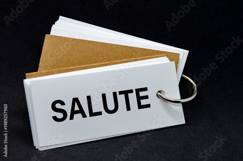 SALUTE text on white notepad. A Simple Gesture, A Powerful Message of Recognition and Encouragement