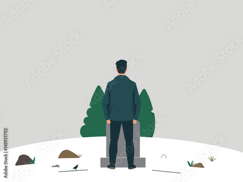 Man standing in front of gravestone in a quiet winter landscape  