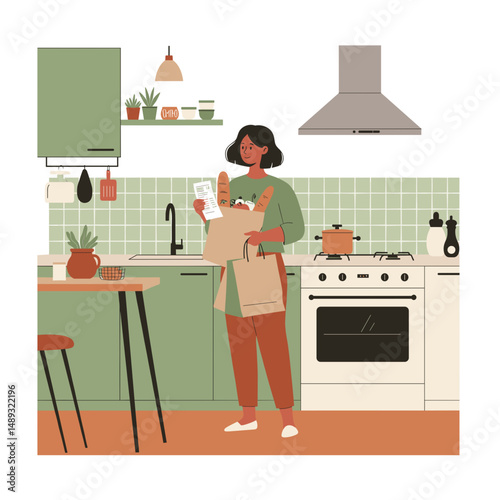 Woman holding grocery bag while standing in modern kitchen at home  