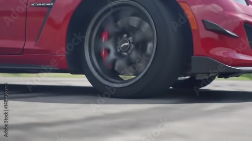 Car Tire Spinning and Smoking on Asphalt Road in Slow Motion