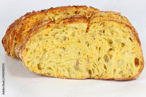 Sliced corn bread isolated on a white background. Golden crust and soft yellow interior