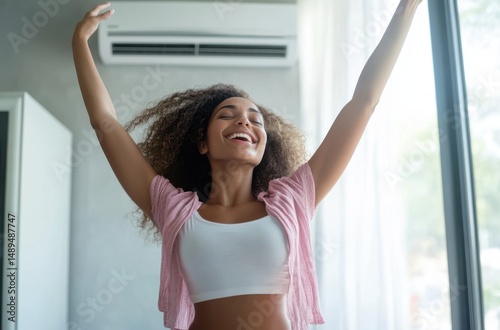 Free Download Energetic woman dancing joyfully under a newly installed - GFXLoad