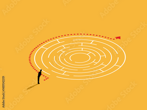 Businessman looks at the simple path to solve the maze puzzle.