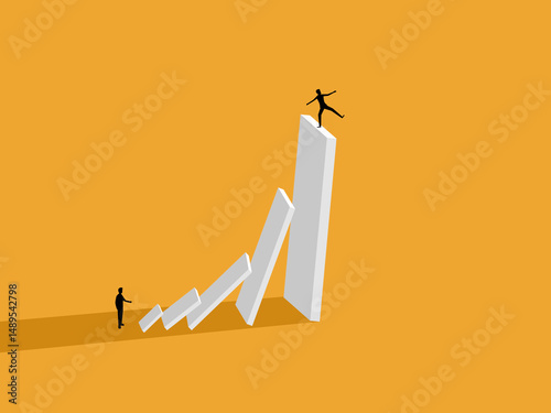 Businessman being bullied on a falling domino