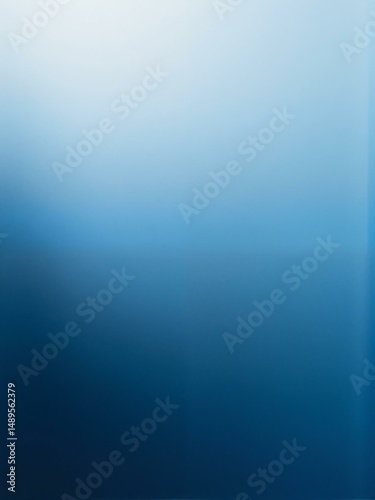 Abstract image with blue shades of light fading out on both ends.
