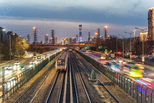 The rail transit and highway vehicle flow at night in the Guomao building complex area of Beijing, China