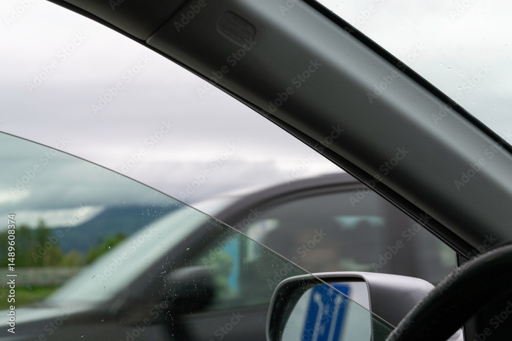 Naklejka premium View from Inside a Car with Passing Vehicle on the Highway