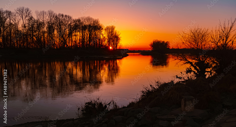 Fototapeta premium Spring sunset or sundowner with reflections near Straubing, Danube, Straubing-Bogen, Bavaria, Germany