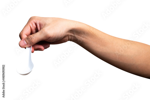 Male hand holding a white plastic spoon isolated on white background.